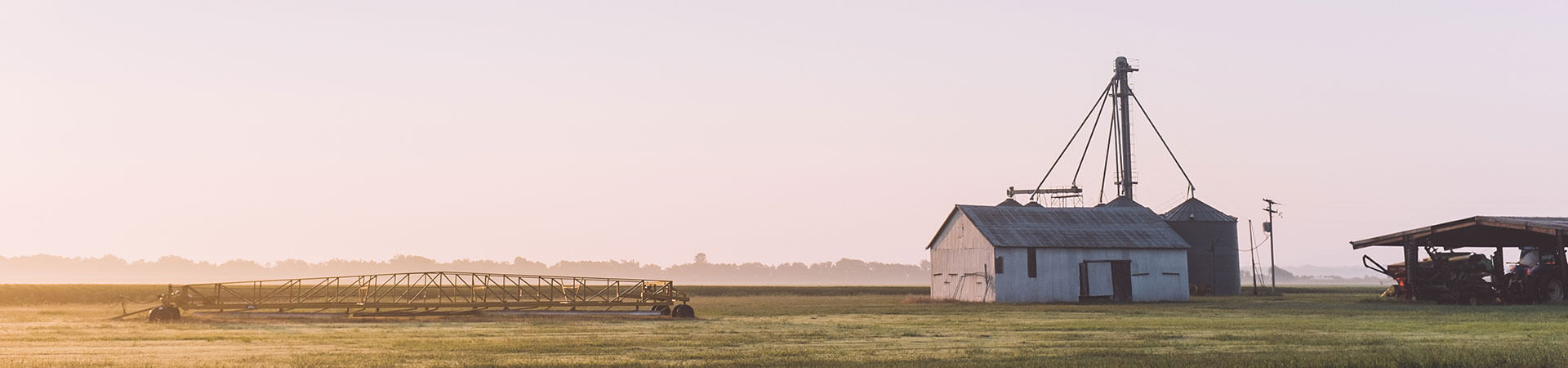 farm building and machines early in the morning farm building and machines early in the morning